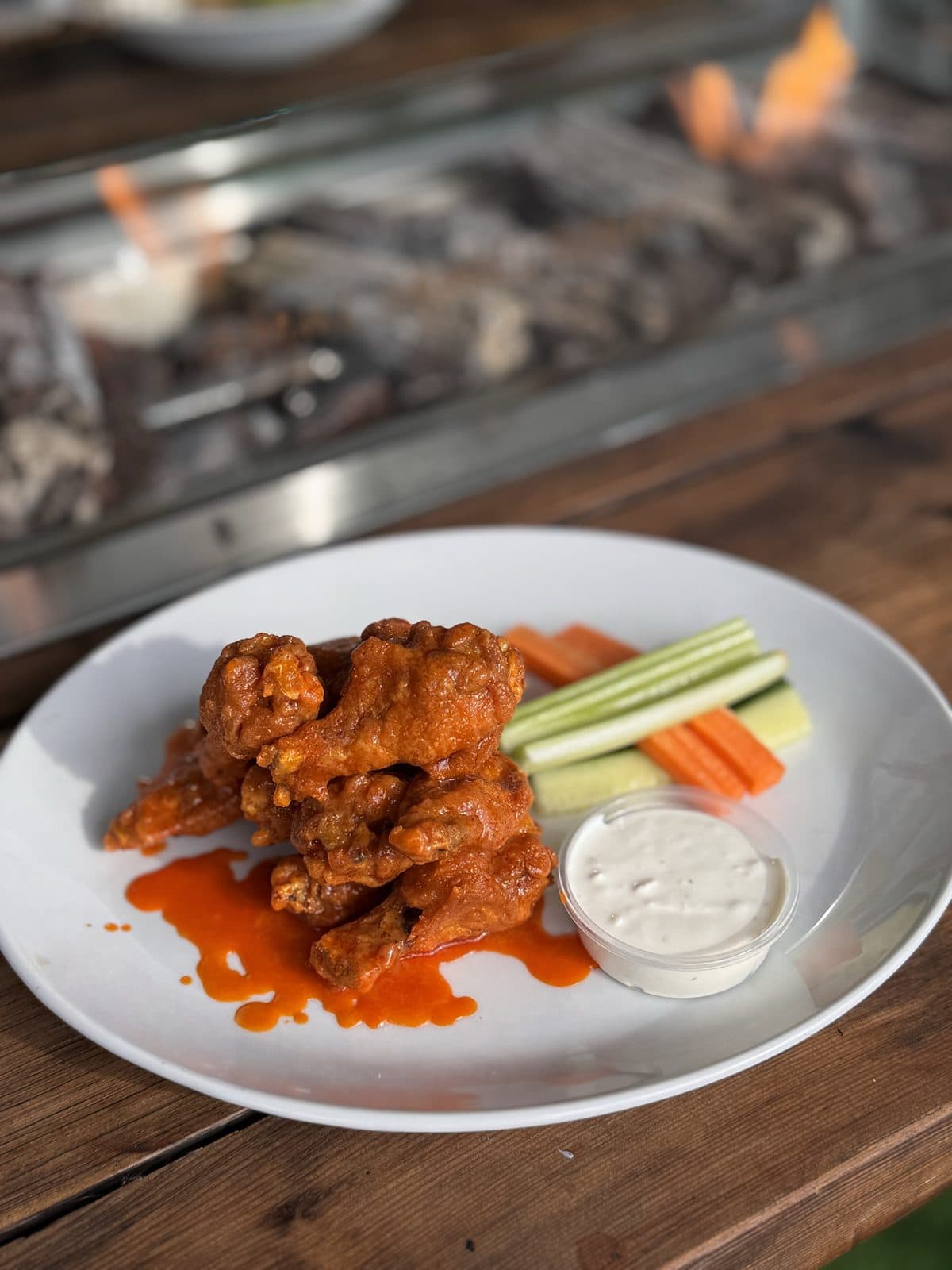 Chicken wings with veggie sticks and a dip